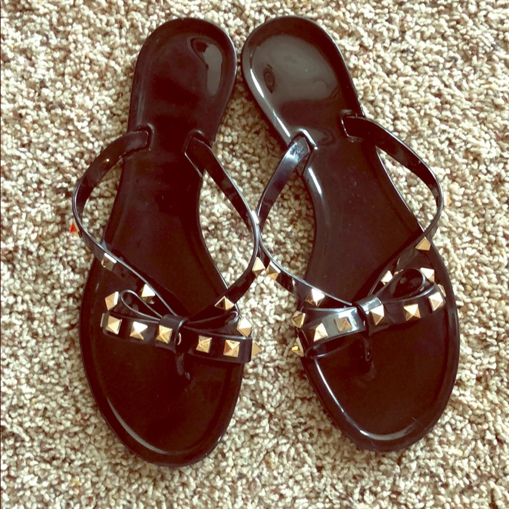 Black studded jelly sandals